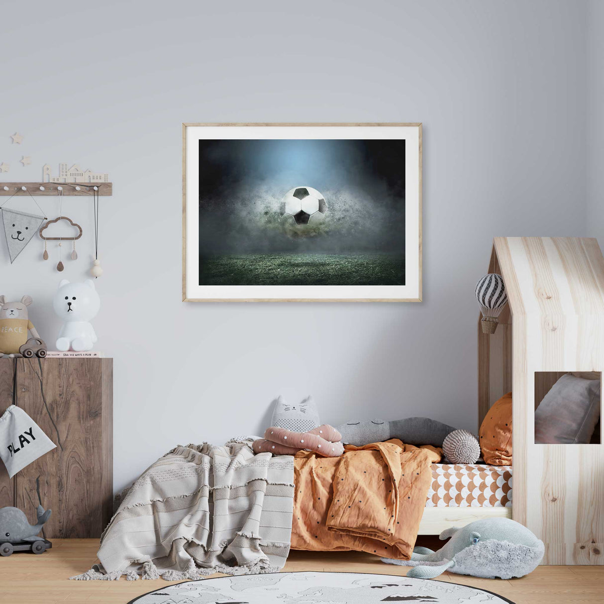 Striking soccer wall art print showcasing a football bursting through mist and turf, ideal for sports-themed decor."