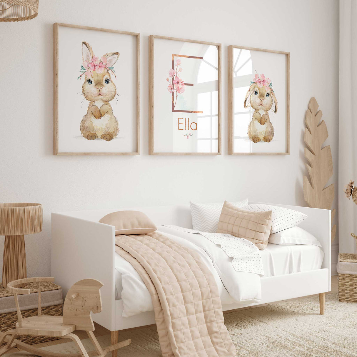 A set of three unframed art prints featuring cute woodland bunny illustrations with floral elements.