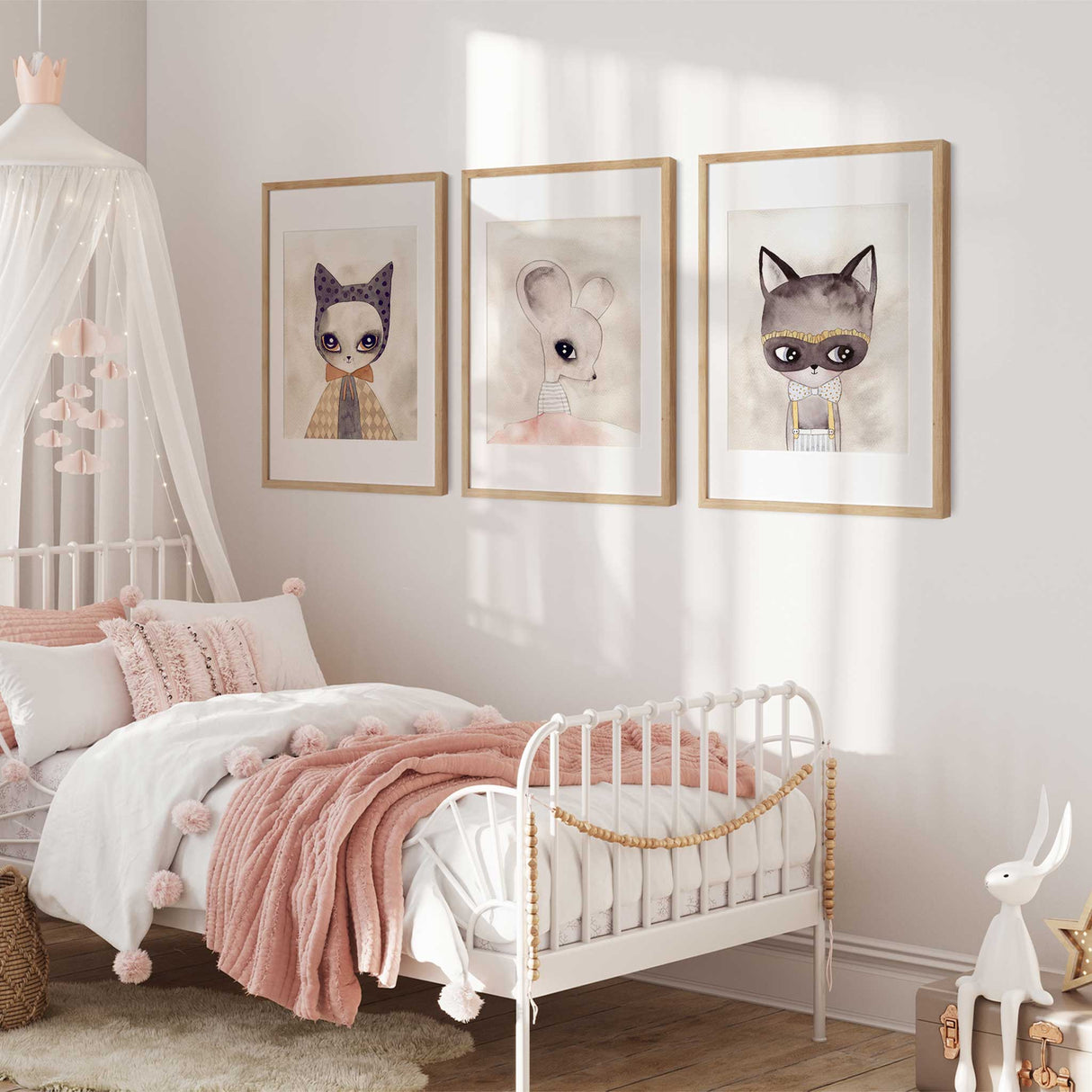 Animal character nursery wall art with soft neutral illustrated animals for girls room