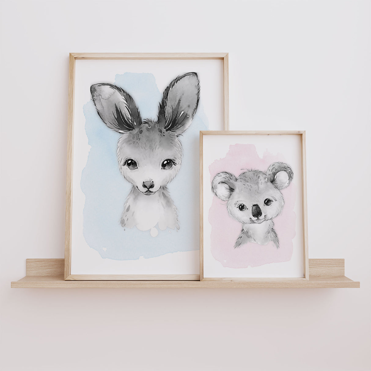 nursery wall art prints featuring a baby kangaroo and koala in soft watercolour style on blue and pink backgrounds