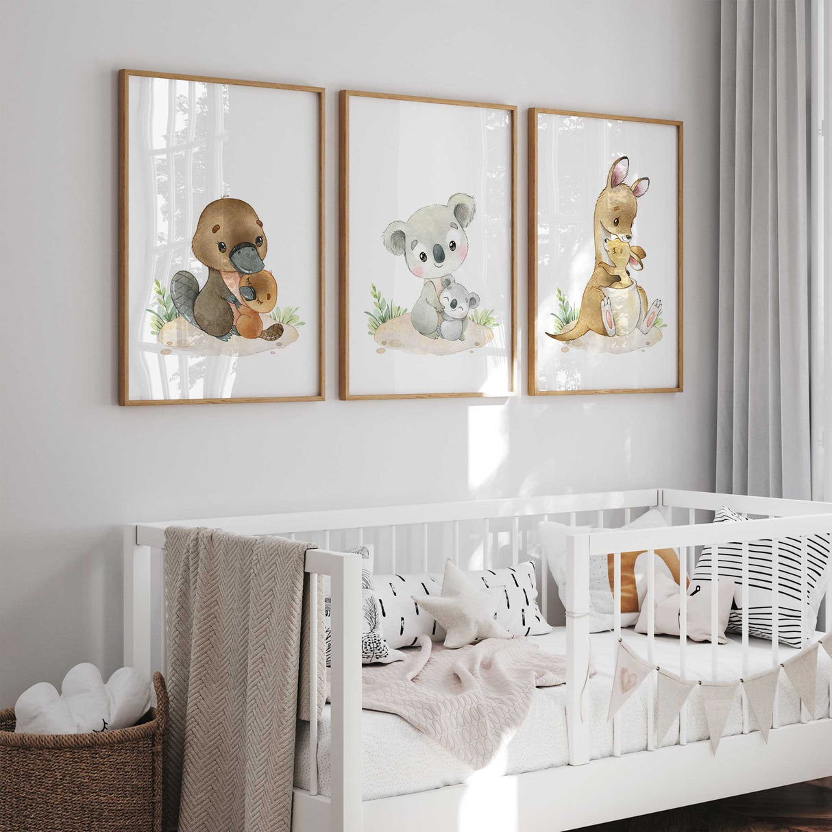 Australian animal wall art set featuring platypus, kangaroo, and koala, styled in minimalist neutral nursery setting.