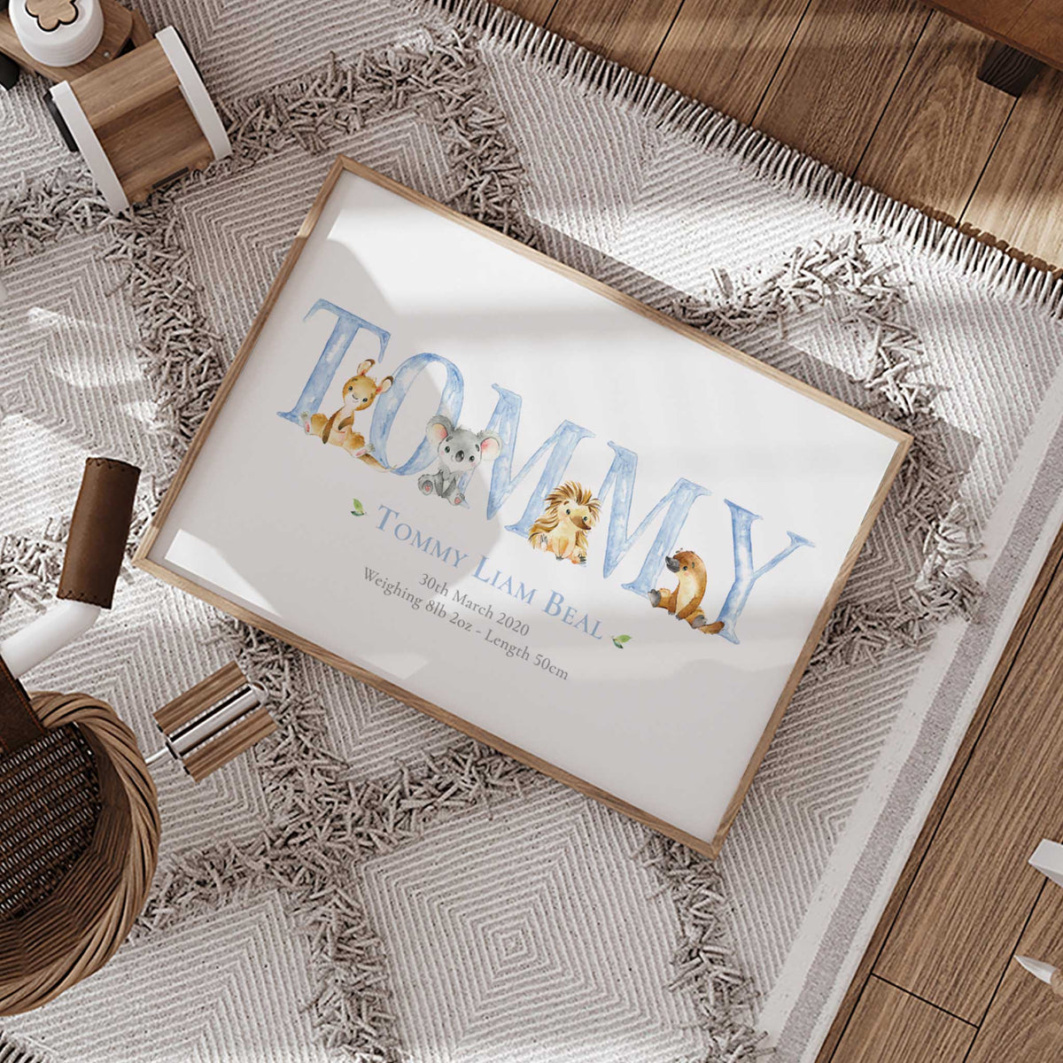 Australian baby birth details print with native animals arranged throughout the child’s personalised blue name