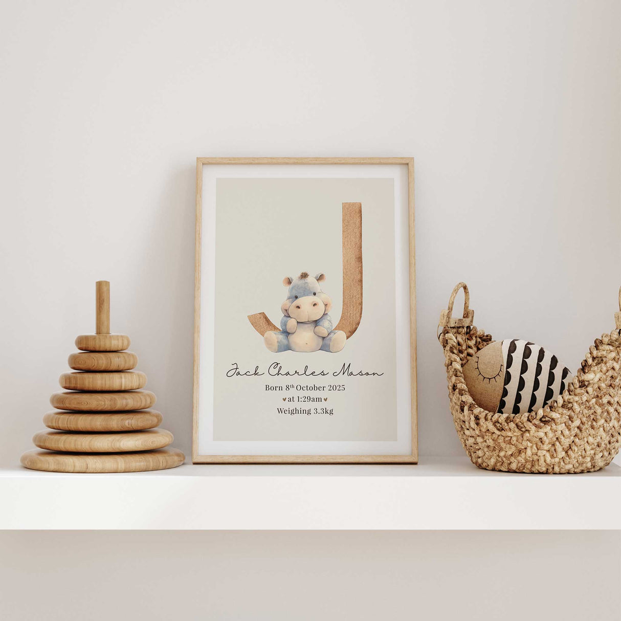 Personalised neutral nursery print featuring your babys letter with plush hippo toy and baby birth details, ideal wall art for boys or girls.