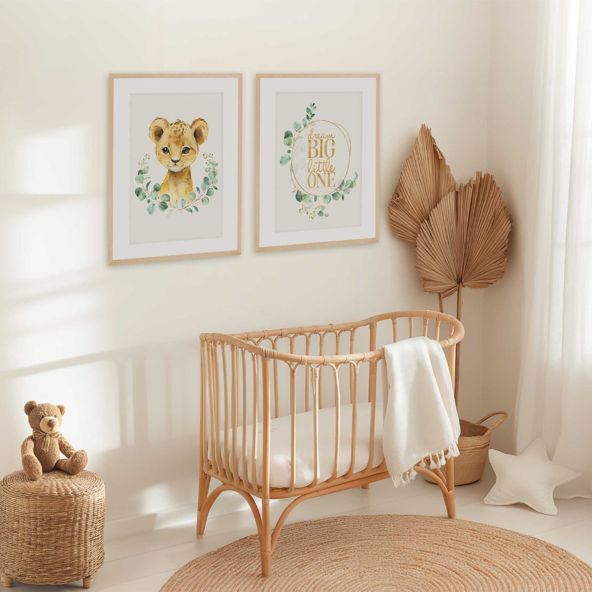 Baby nursery wall art set featuring lion print and Dream Big Little One quote with green eucalyptus wreath