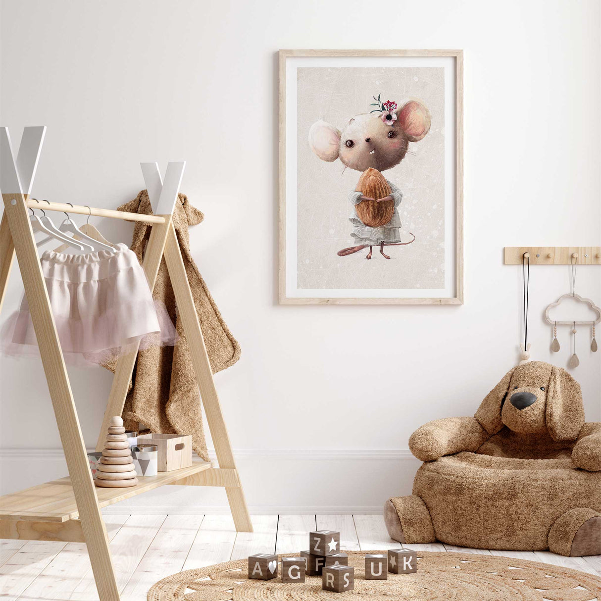 Baby room artwork featuring illustrated mouse holding acorn in warm soft toned nursery style