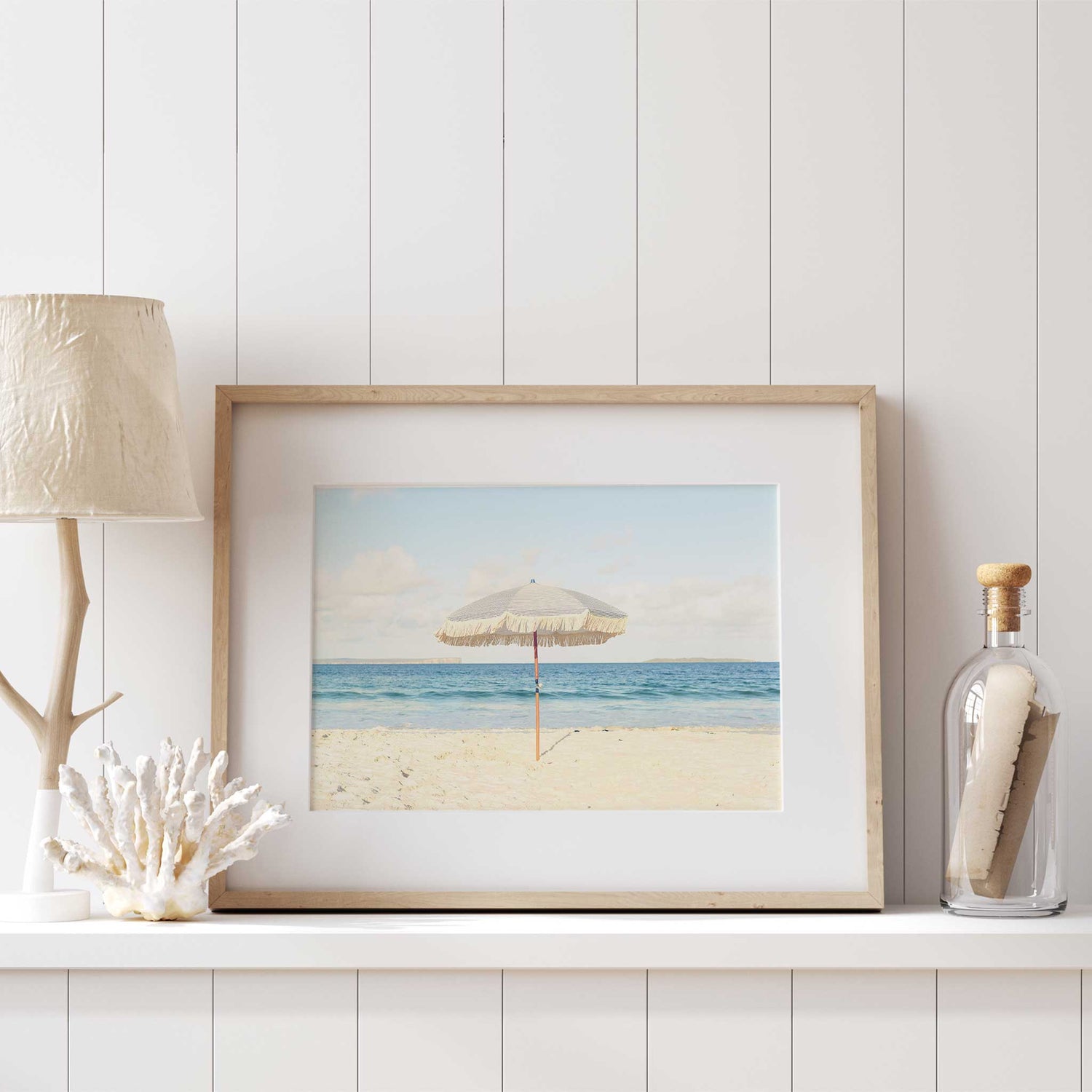 Minimalist beach print for bedroom or bathroom decor, featuring soft sand and sky tones.