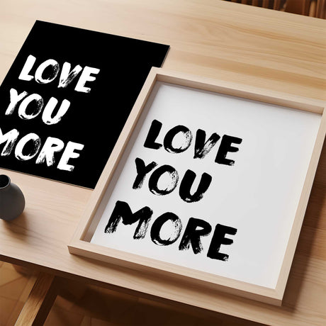 White text on black background Love You More print