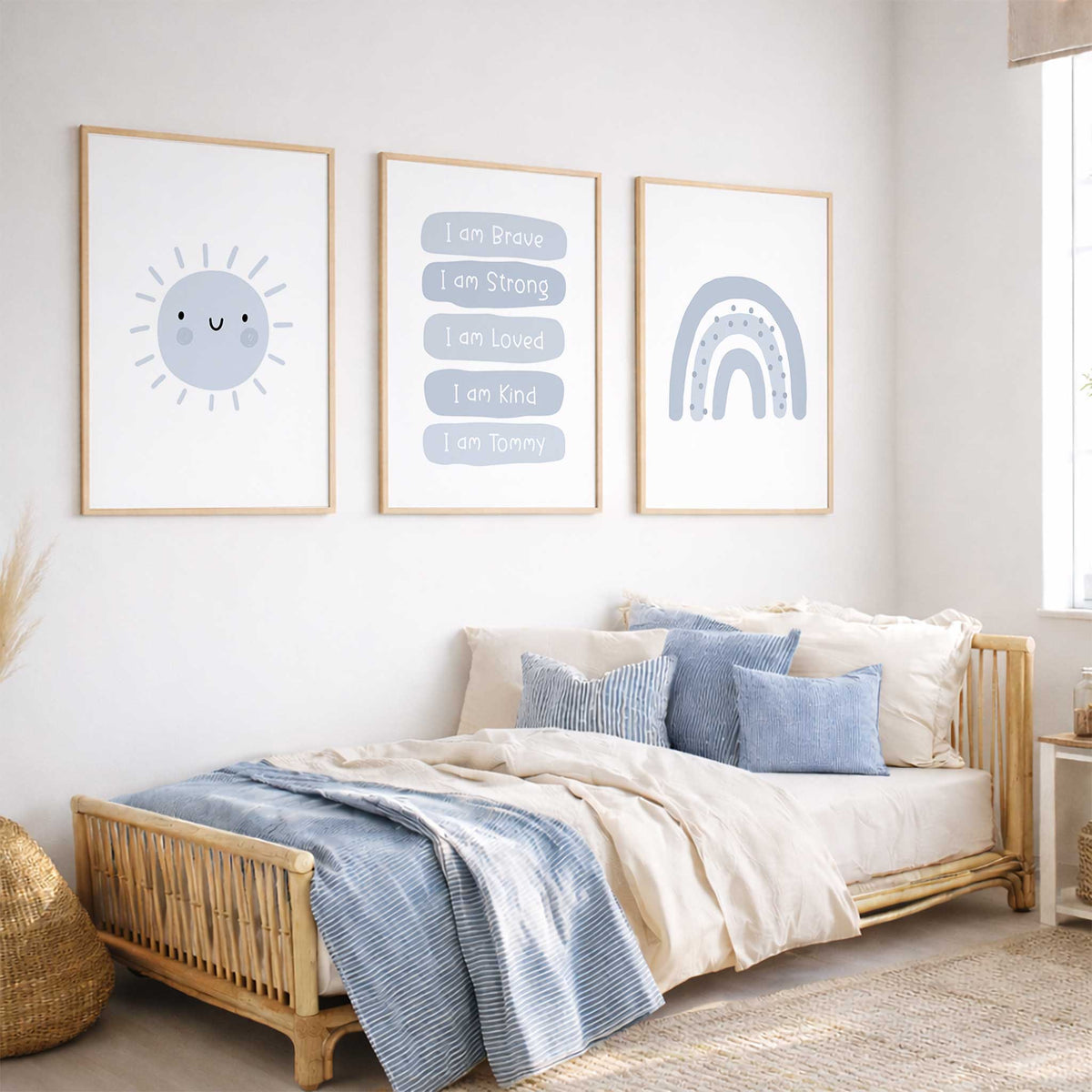Personalised blue affirmation print set featuring a smiling sun, dotted rainbow and white lettering on rounded blue panels.