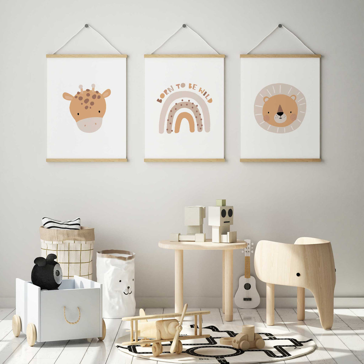 Safari print trio with a spotted giraffe, a lion with a circular mane and a Born to Be Wild rainbow on pale backgrounds.