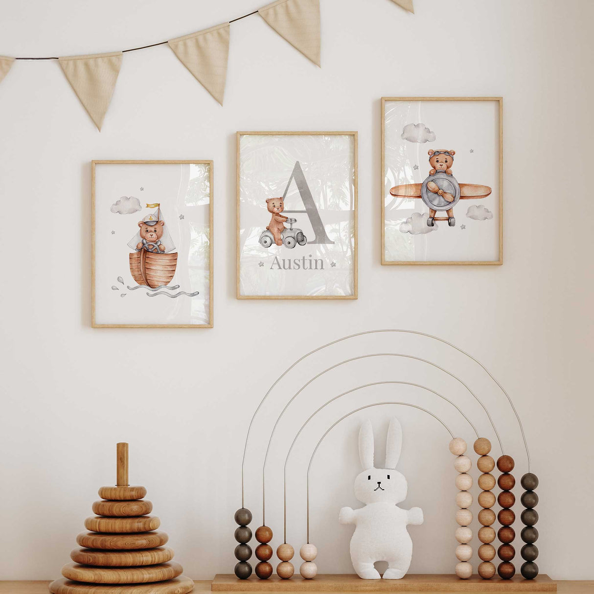 Adventure-themed bear wall art set for boys’ nursery with aeroplane, vintage car, and sailing boat illustrations.
