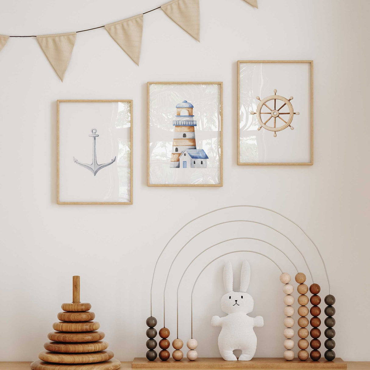 Boys' bedroom wall art set with nautical anchor, lighthouse, and ship wheel prints
