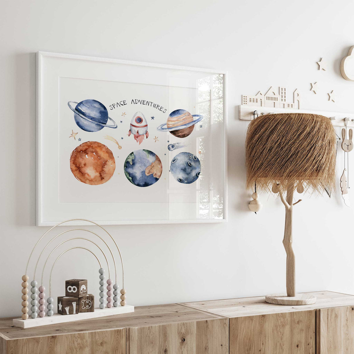 Boys room decor with vibrant illustrations of planets and stars, adding an intergalactic touch.