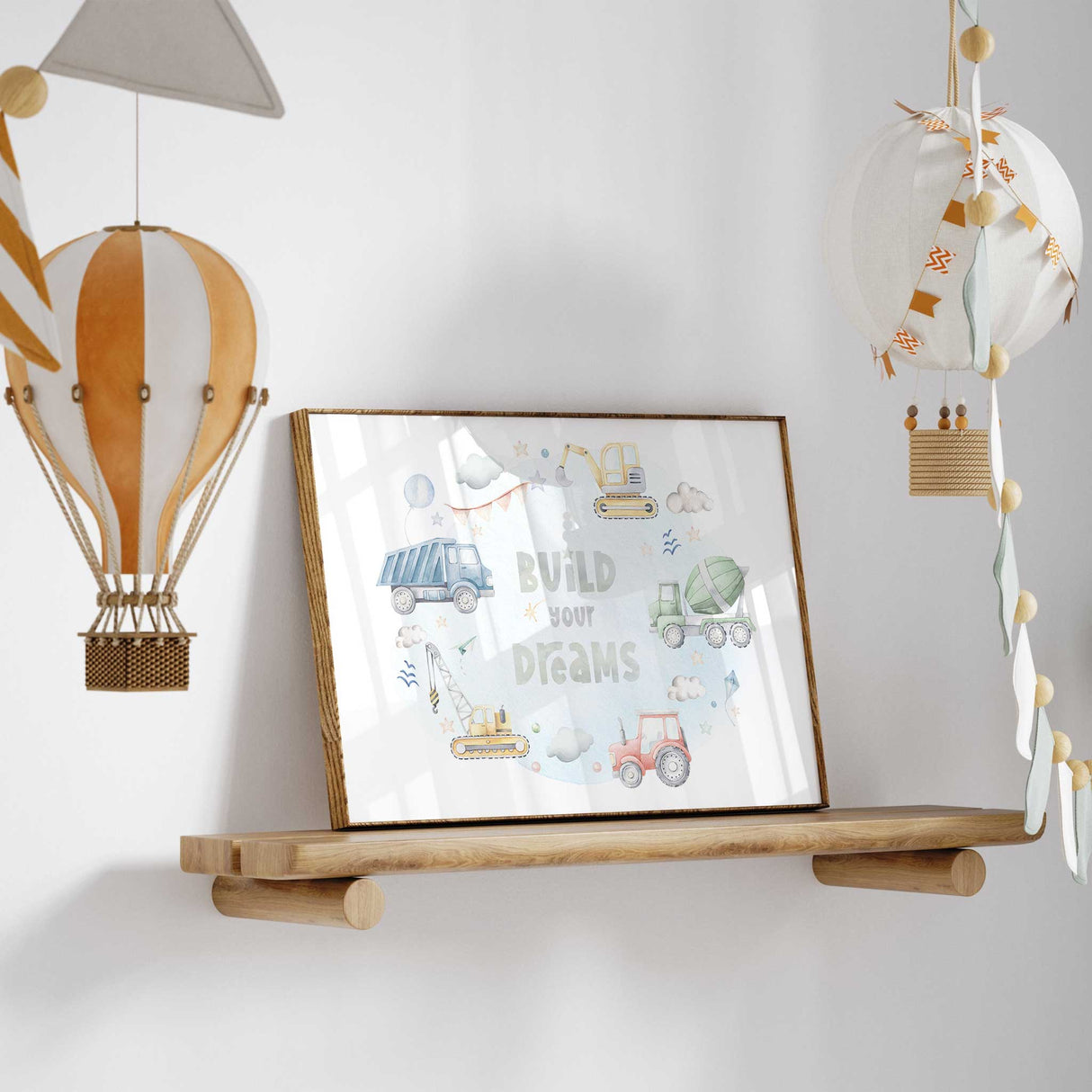 Build Your Dreams construction wall art with soft watercolour dump truck digger crane cement mixer and tractor surrounding an inspiring quote for boys room décor.