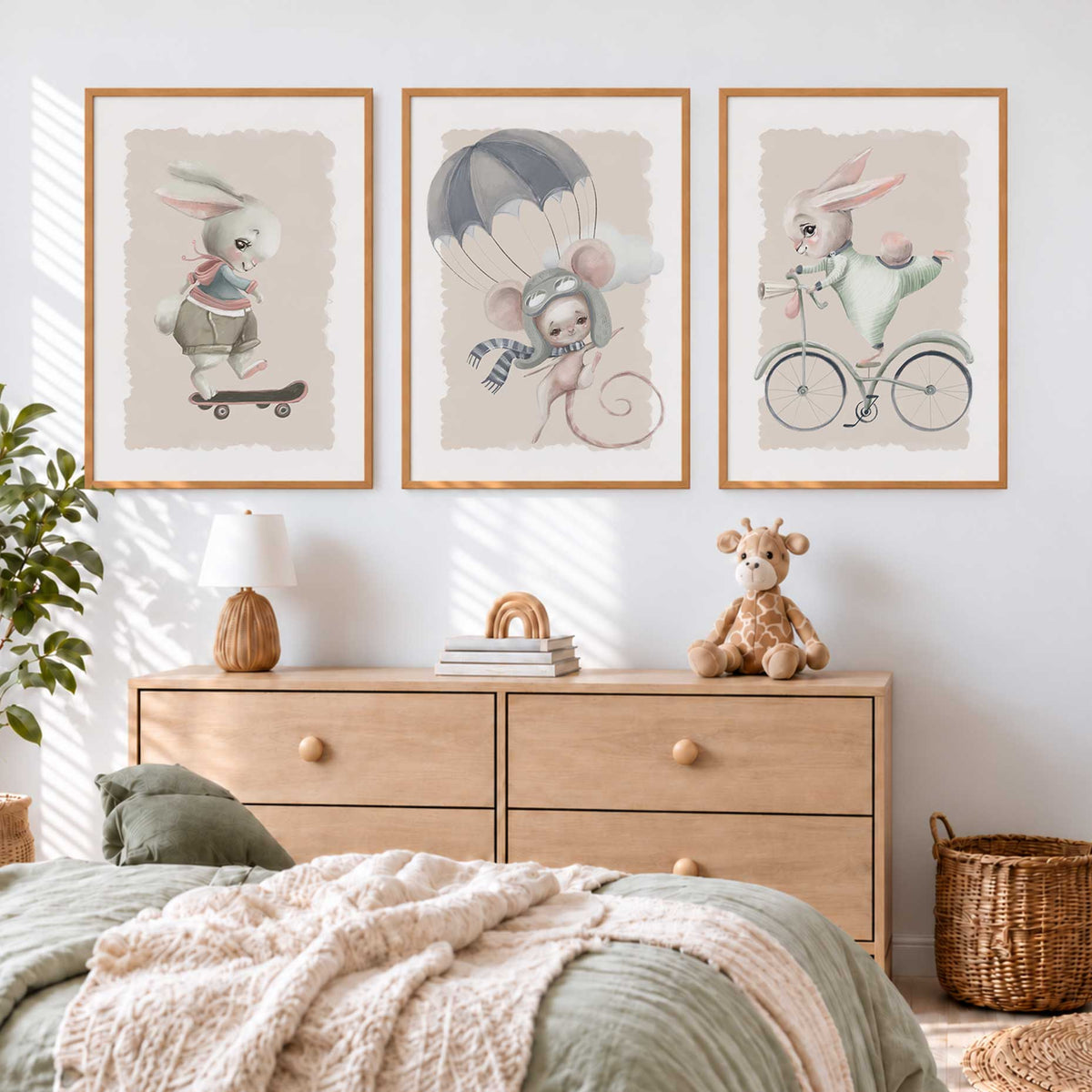 Bunny and mouse wall art set with a skateboard, blue-grey parachute and bicycle in muted sage, pink and beige tones.