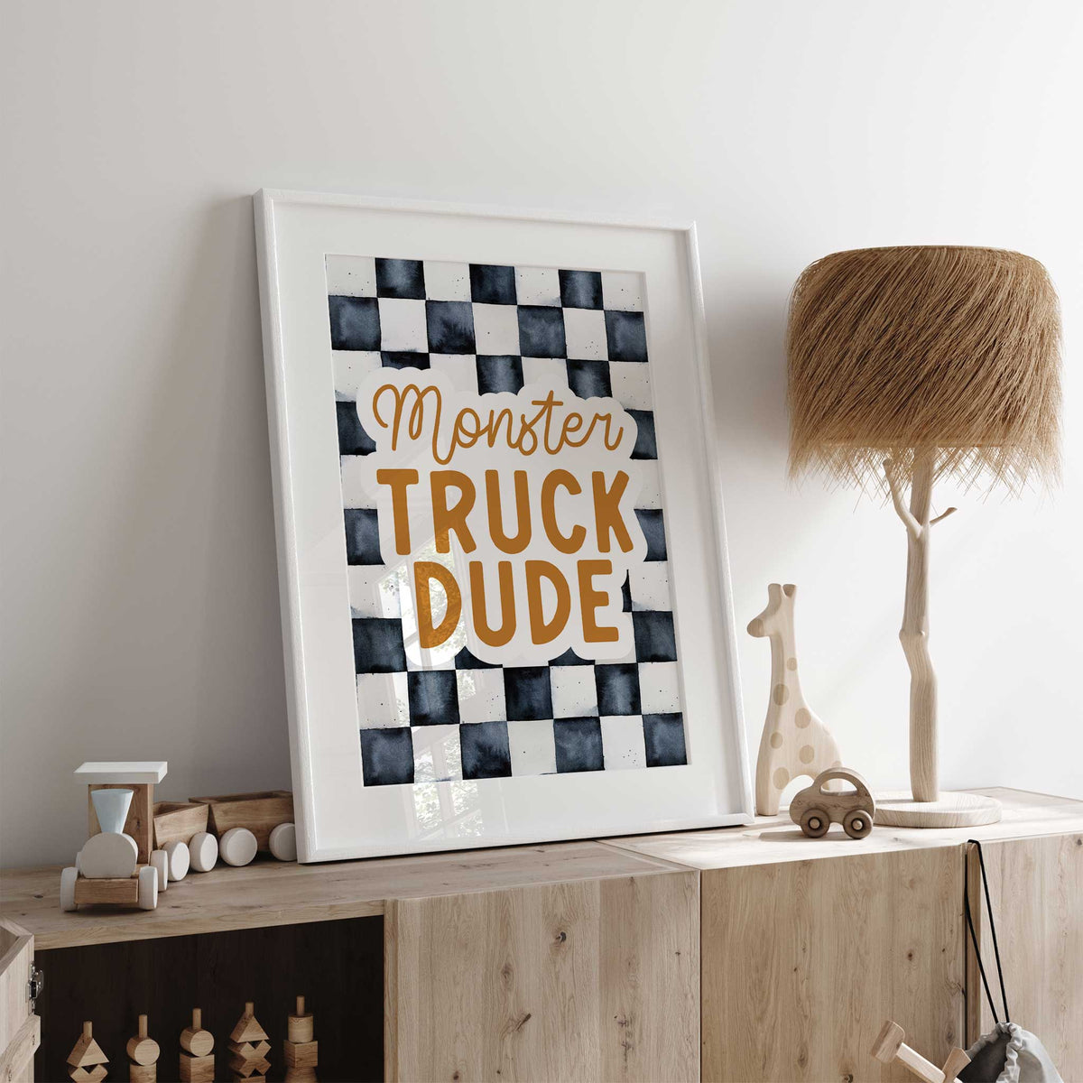 Monster Truck Dude typography print featuring ochre words, an off-white text outline and a charcoal checkered background.