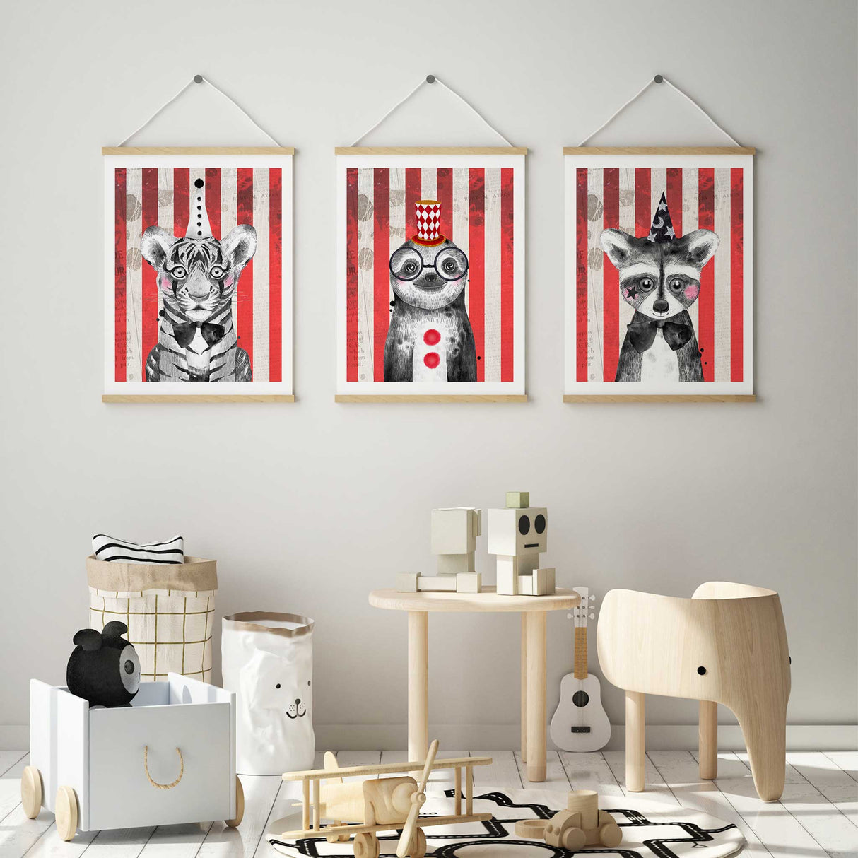 Black and white animal portraits of a tiger, sloth, and raccoon with circus inspired details, enhanced by a red and white striped backdrop
