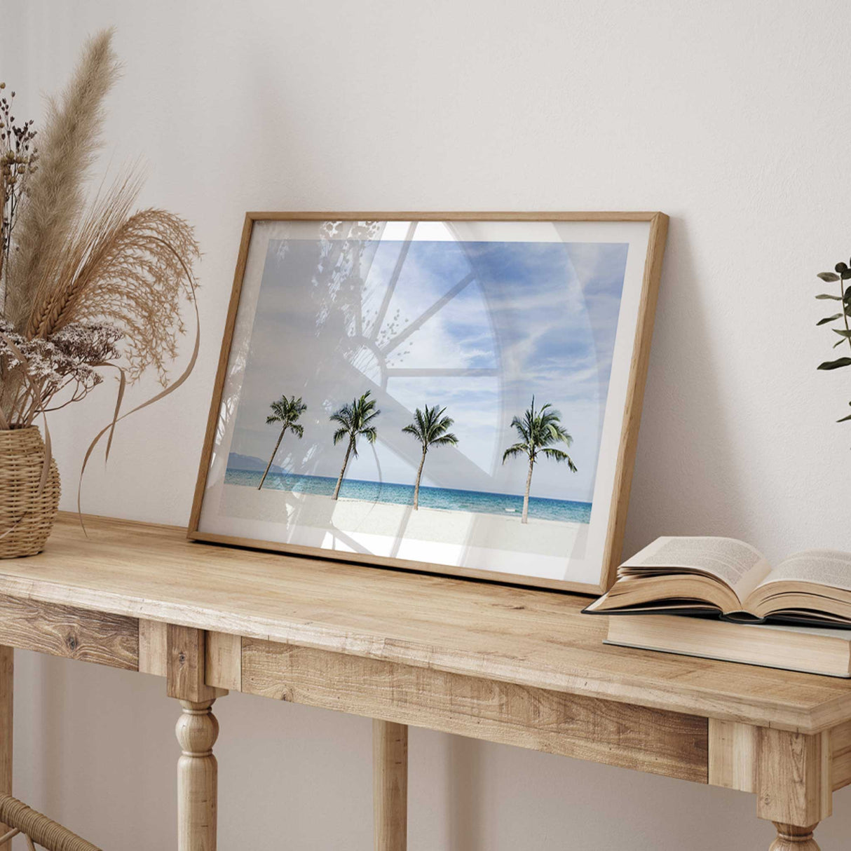 Coastal beach photography print with palm trees, pale sand and turquoise water for a relaxed beach house look.