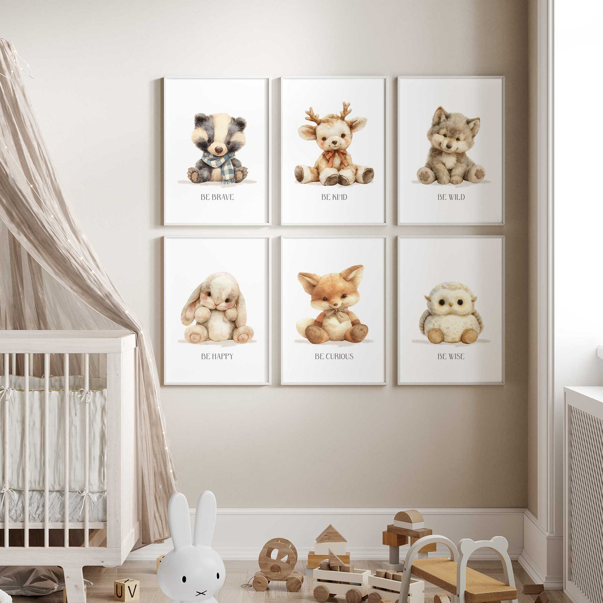 Deer and fox nursery wall prints with motivational text 'Be Kind' and 'Be Curious' styled in a cozy kids bedroom
