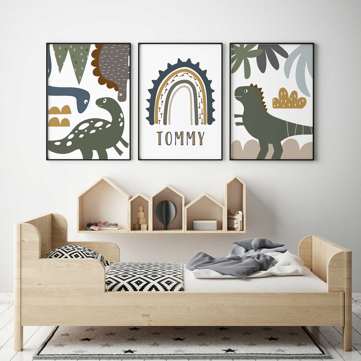 Dinosaur wall art set of three featuring illustrated dinosaurs and a personalised name print in earthy neutral colours