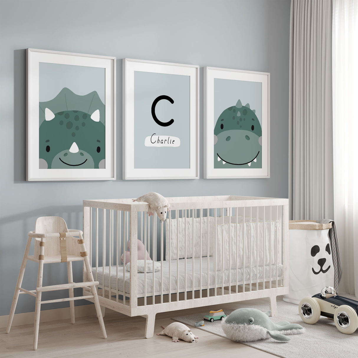 Dinosaur wall art set of three featuring cute dinosaur illustrations and a personalised initial name print in soft green tones