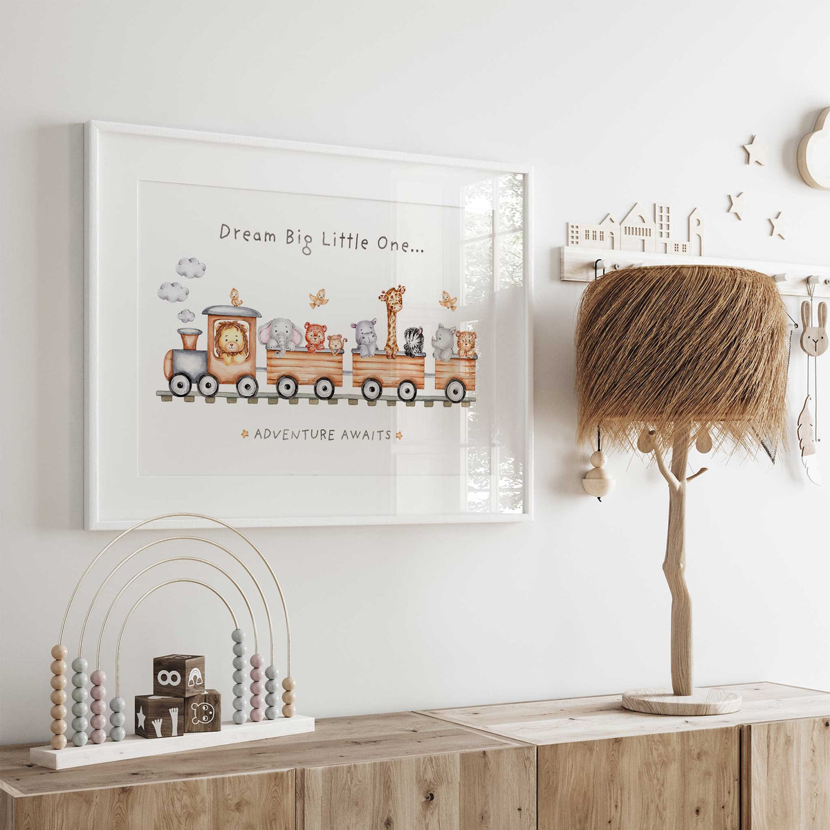Dream Big Little One lettering above a watercolour train carrying safari animals in this single nursery art print