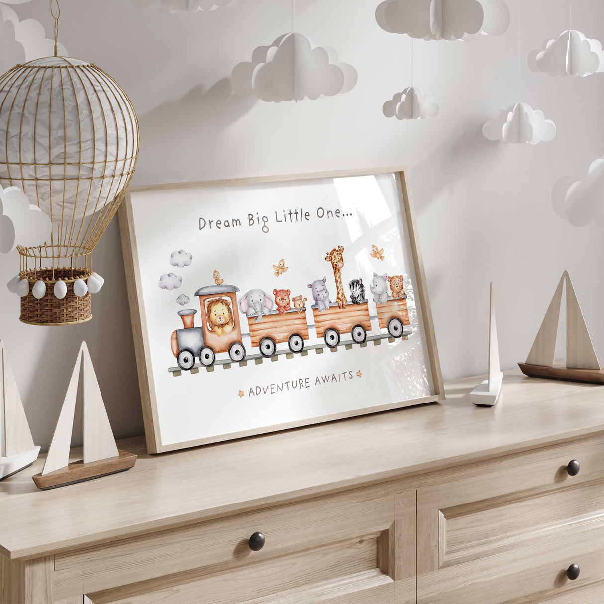 Dream Big Little One nursery wall art with Adventure Awaits quote and safari animals in train