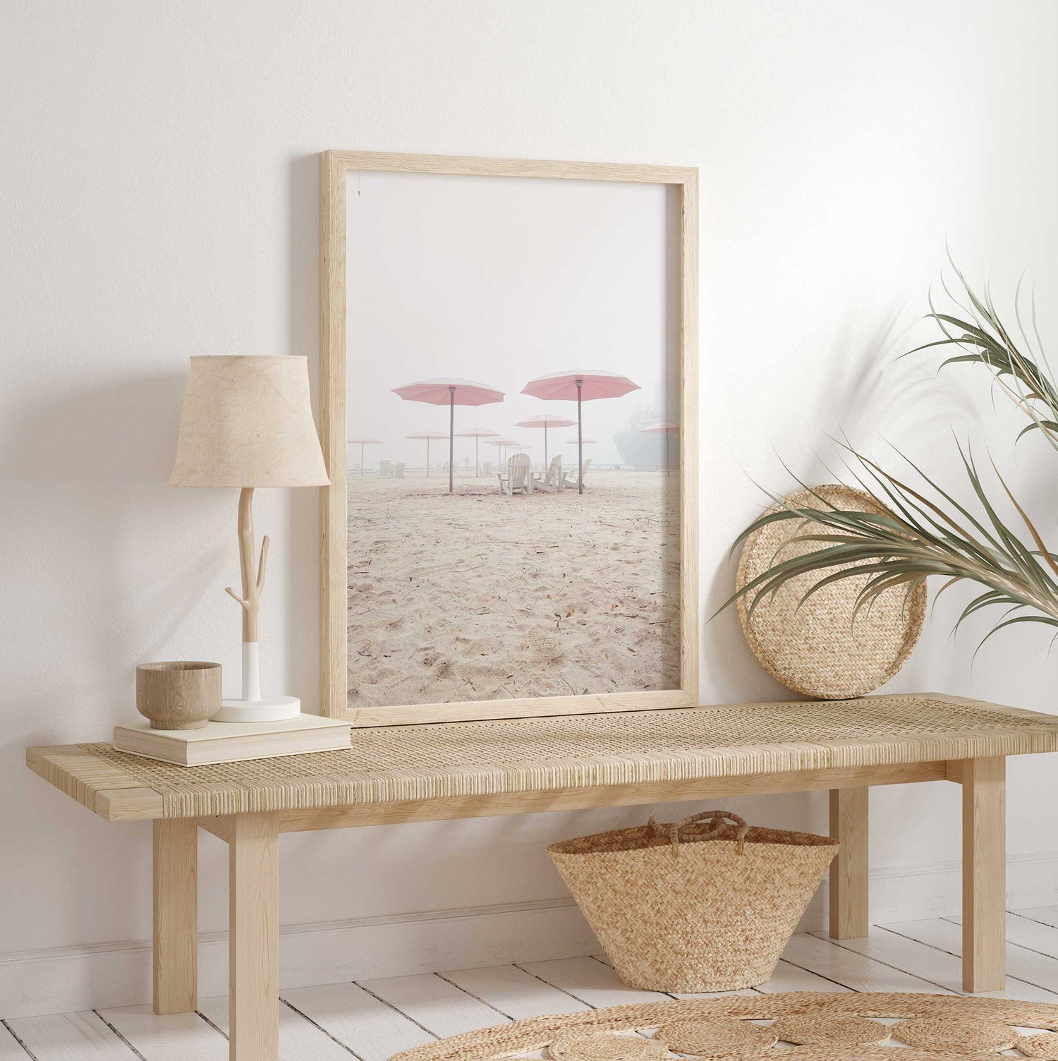 Dreamy beach photo print with blush pink umbrellas and a calm, hazy atmosphere