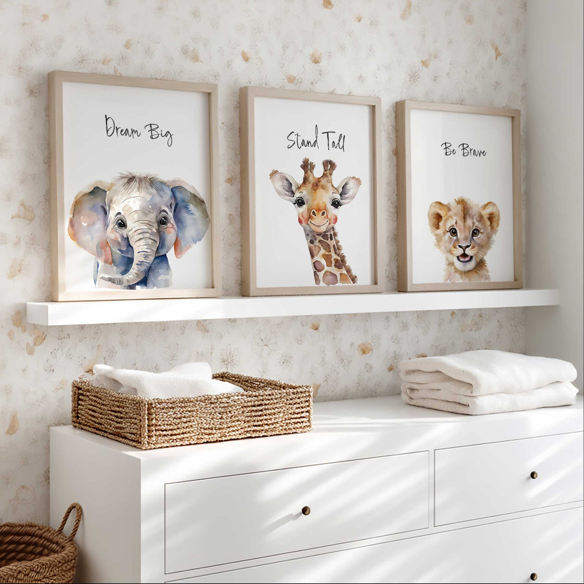Safari nursery prints featuring an elephant, giraffe and lion cub with Dream Big, Stand Tall and Be Brave quotes.