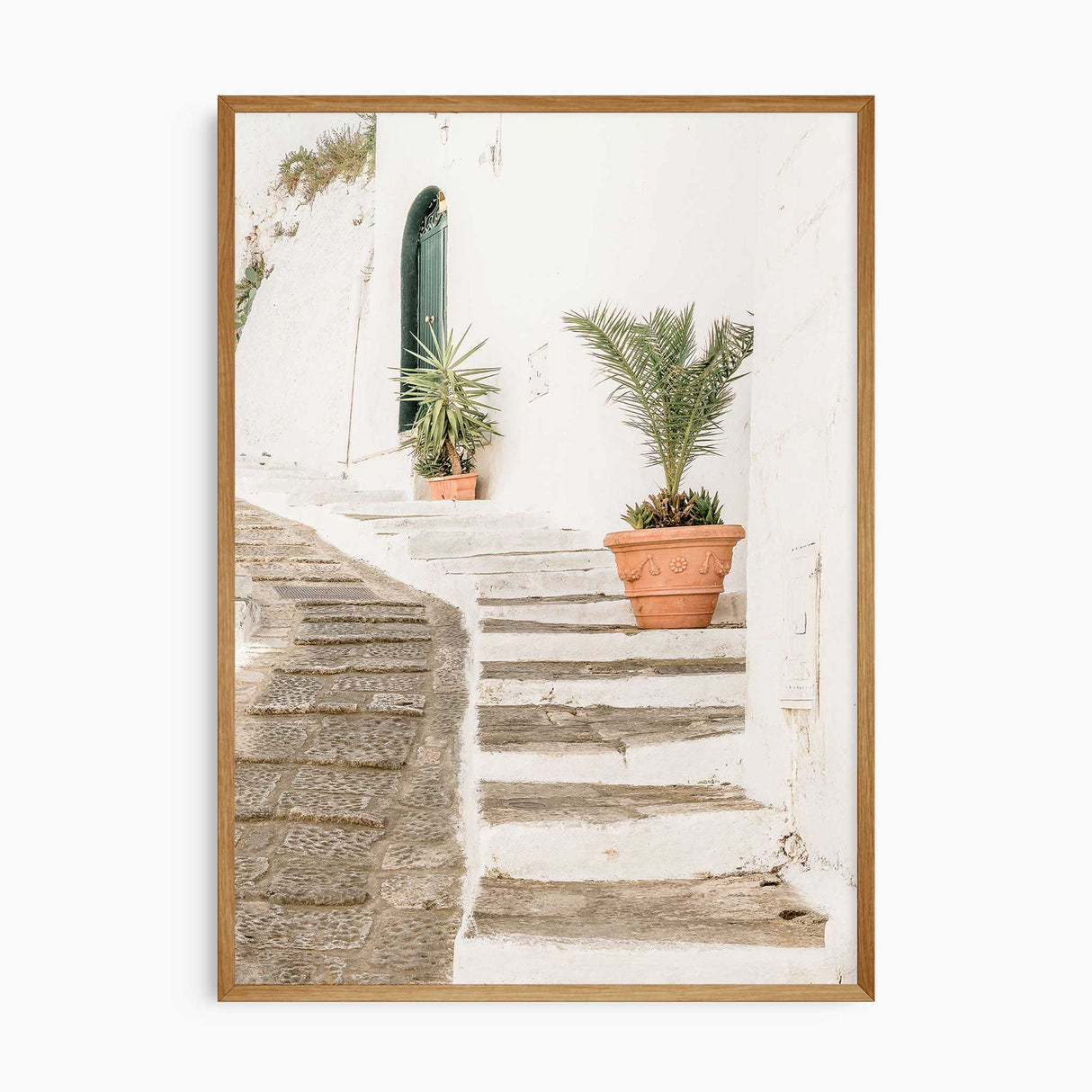 European alleyway coastal art print showing whitewashed steps, palm plants and soft natural sunlight for calm Mediterranean décor