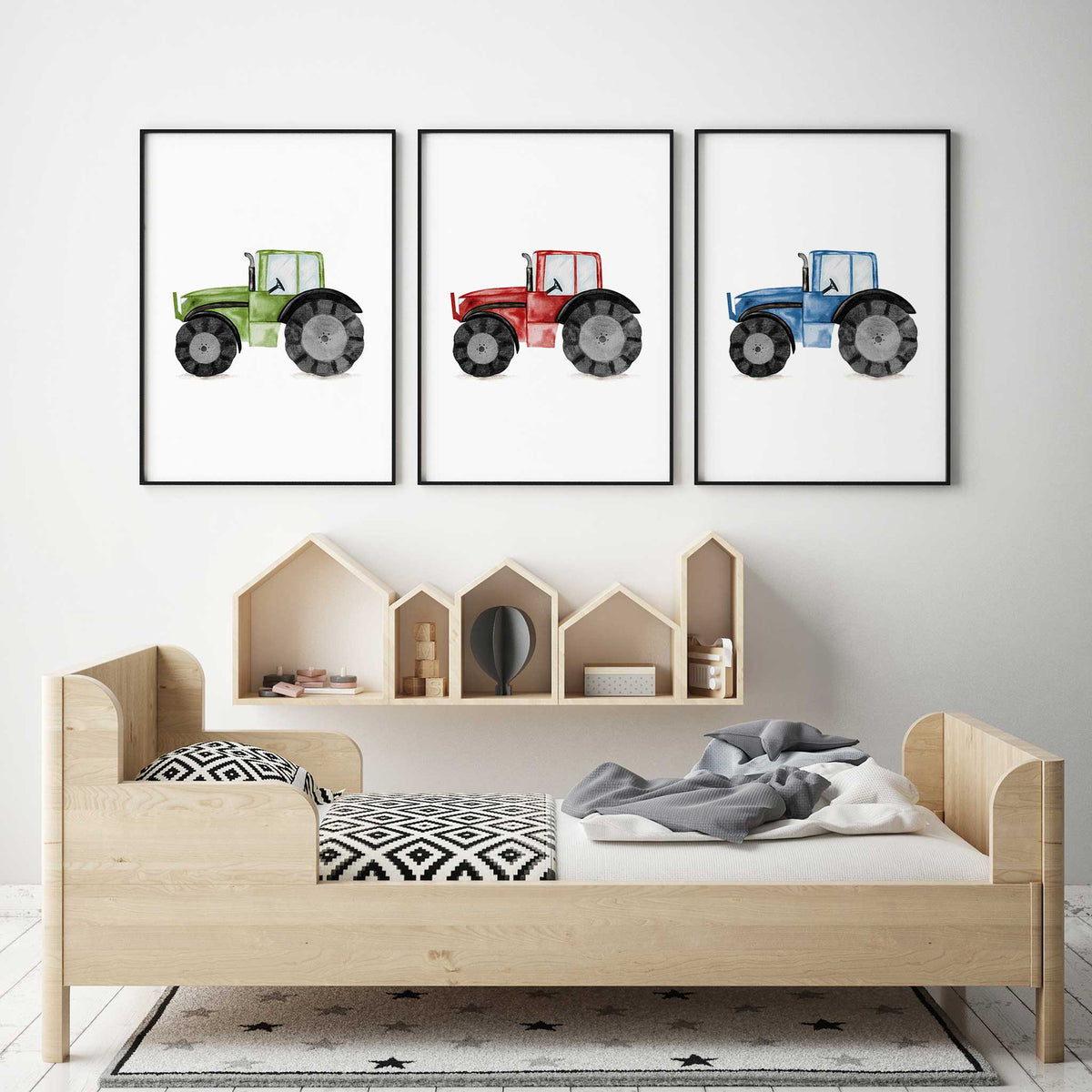Three farm tractor prints in green, red and blue, with watercolour shading and white space around each vehicle.