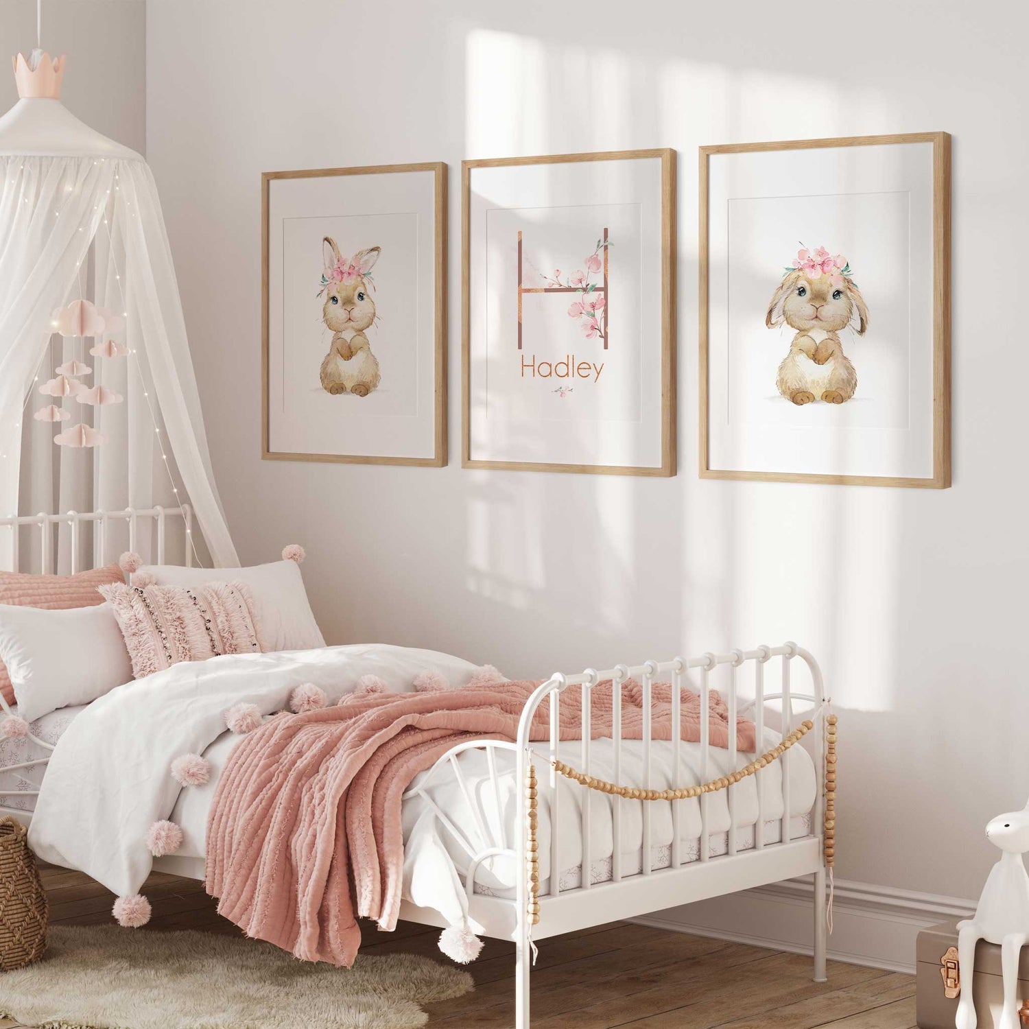 Set of girls' floral nursery prints featuring cute watercolour bunnies and personalised name wall art.