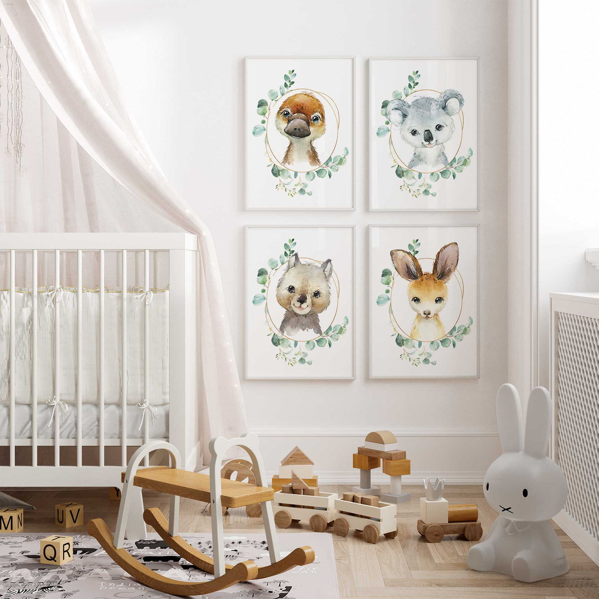 A set of four Australian animal prints, featuring illustrations of a kangaroo, koala, platypus, and wombat, for a nursery room setting.