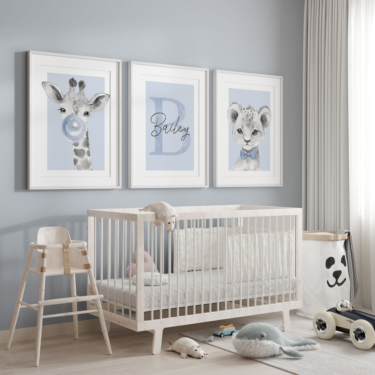 blue background with giraffe and lion nursery print set with personalised initial name artwork