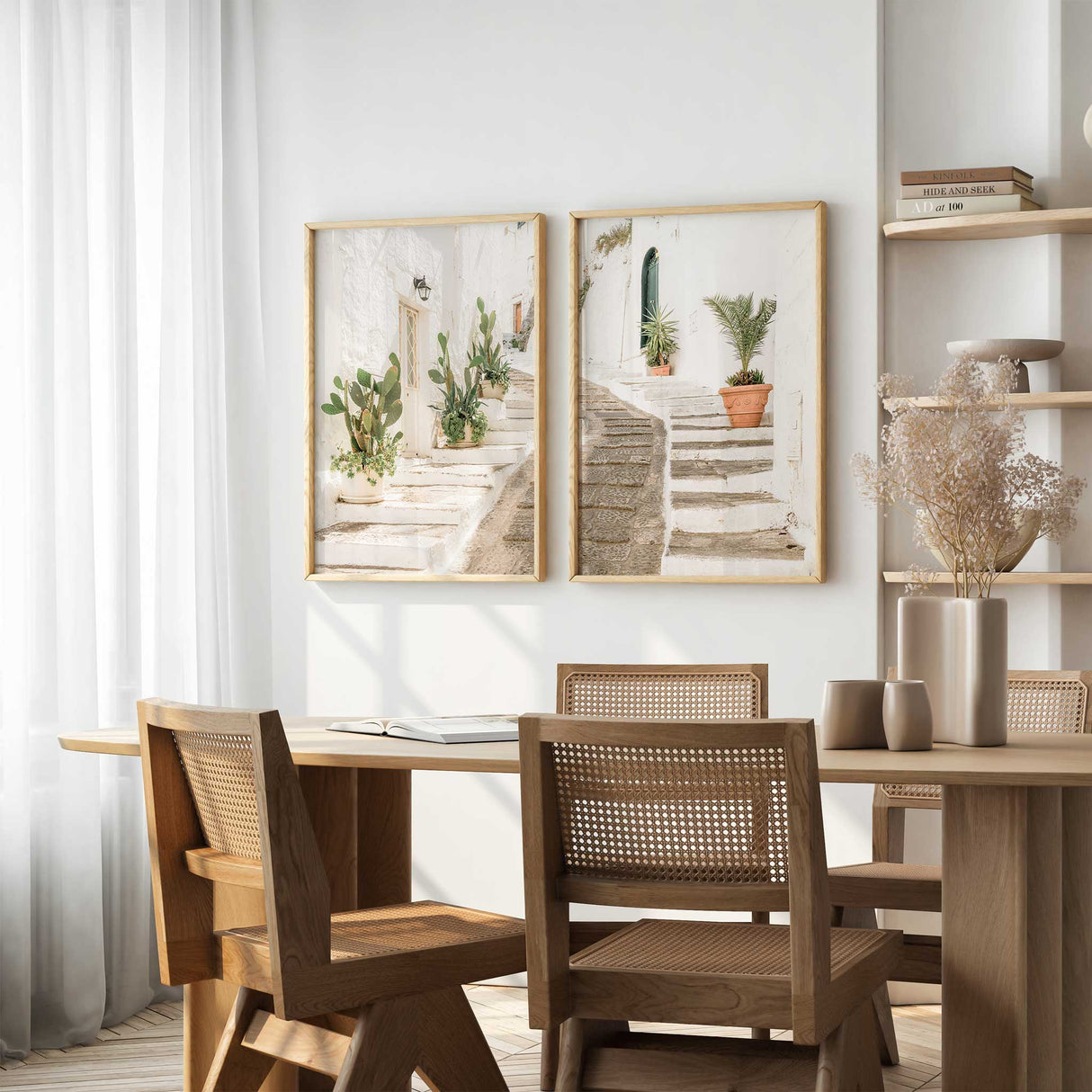 Greek white street wall art featuring sun washed steps, terracotta pots and lush greenery in a bright Mediterranean alleyway setting