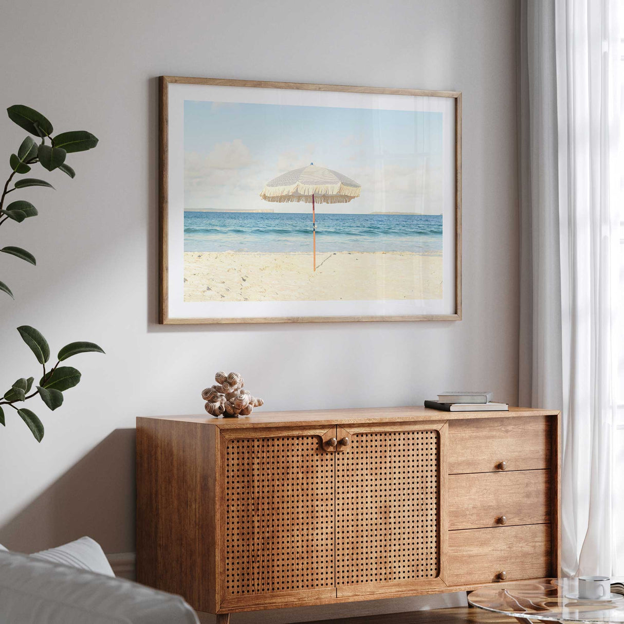 Hamptons-style coastal wall art with a neutral beach theme and a single umbrella by the sea.