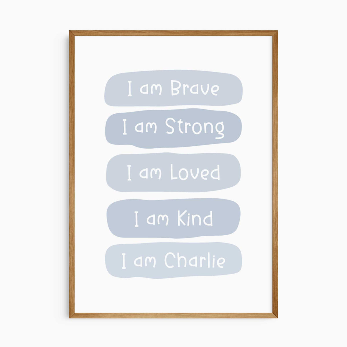 Blue affirmation print with white lettering reading I am Brave, I am Strong, I am Loved and I am Kind, plus a name.