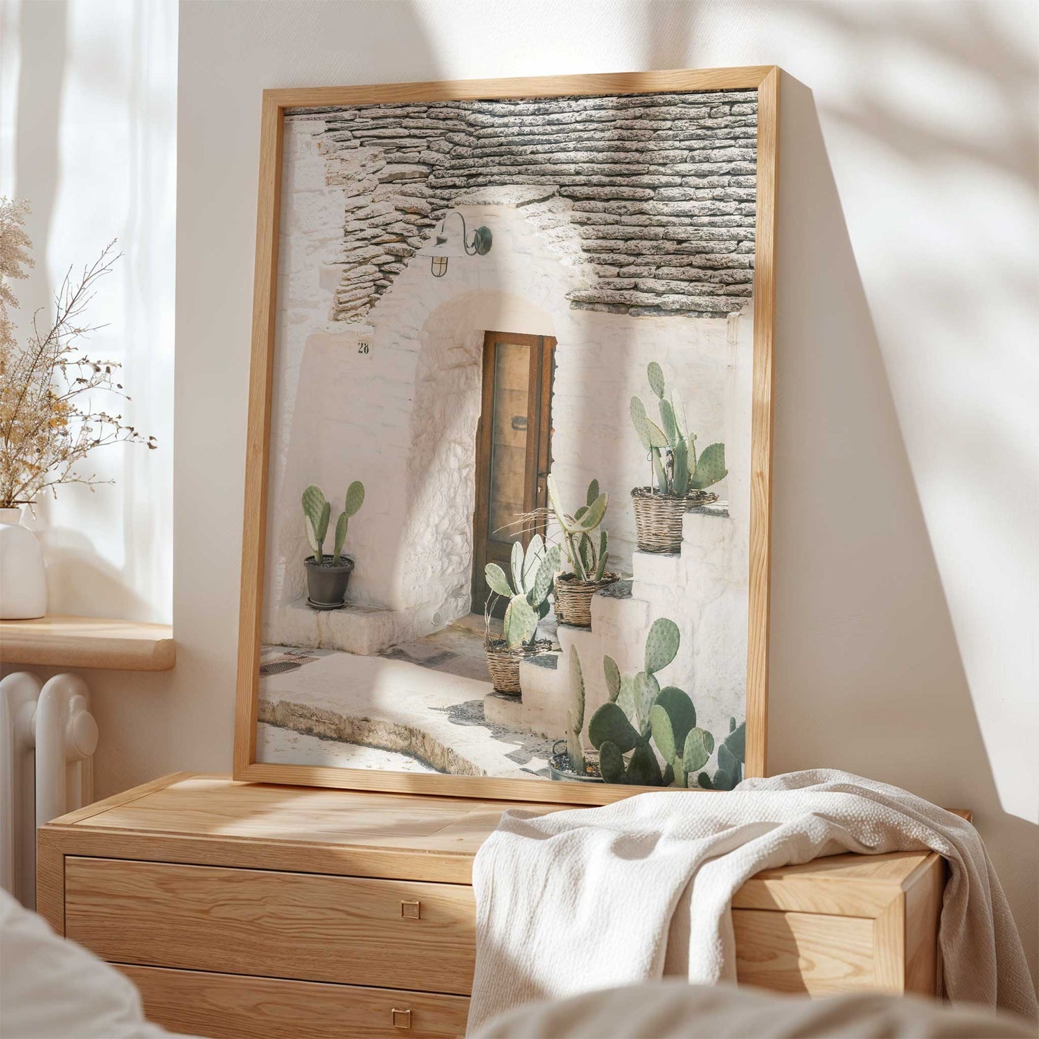 Italian home wall art with cactus plants and rustic white walls