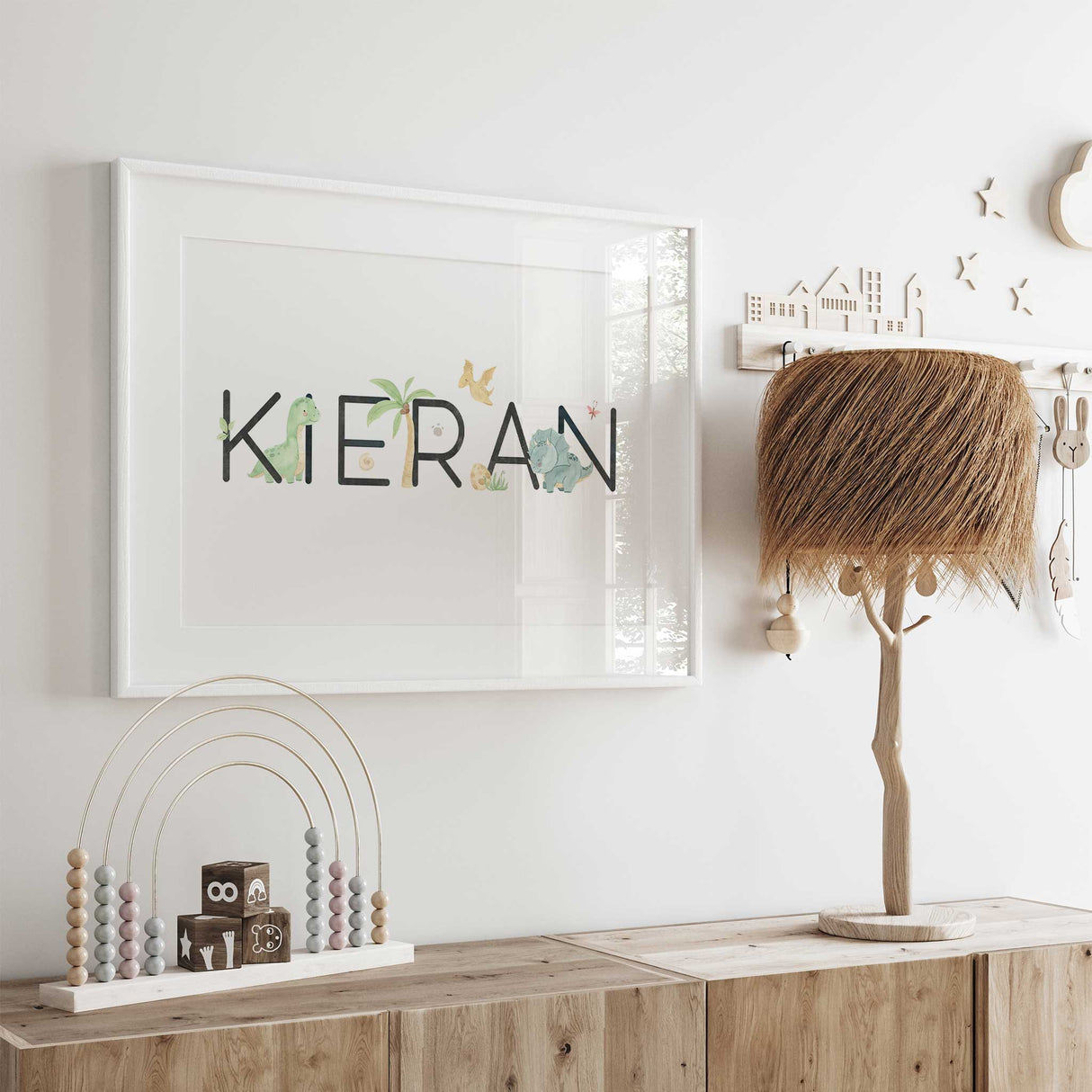 Kids dinosaur name wall print with prehistoric theme and soft colours
