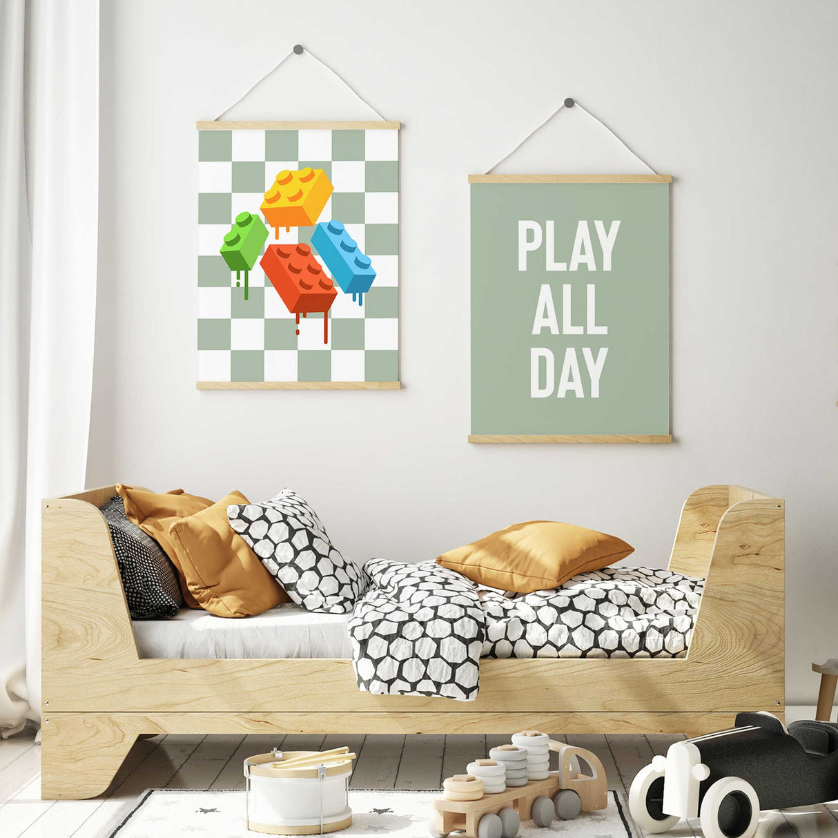 Bold white text PLAY ALL DAY in uppercase with colourful LEGO bricks dripping paint on a black and white checkerboard background.