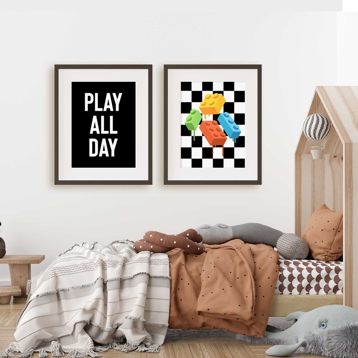Motivational phrase 'PLAY ALL DAY' in bold white letters above melting colorful LEGO-like bricks, all set against a striking black and white checkerboard background.