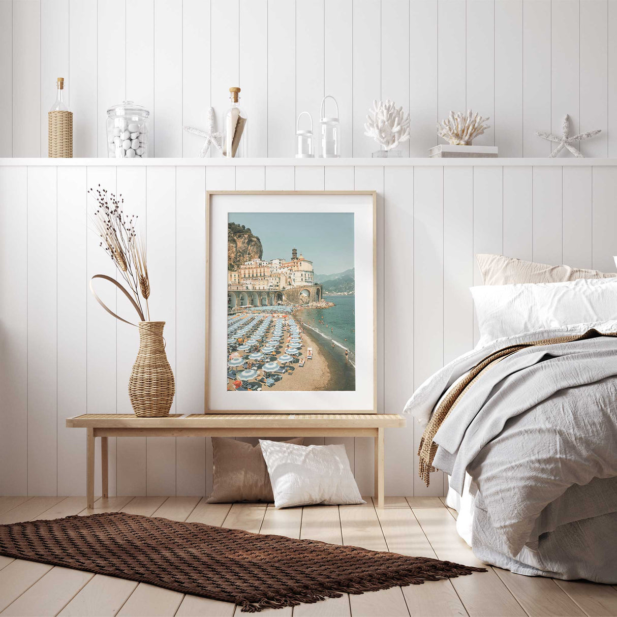 Italian beach scene with pastel parasols and historic coastal buildings.