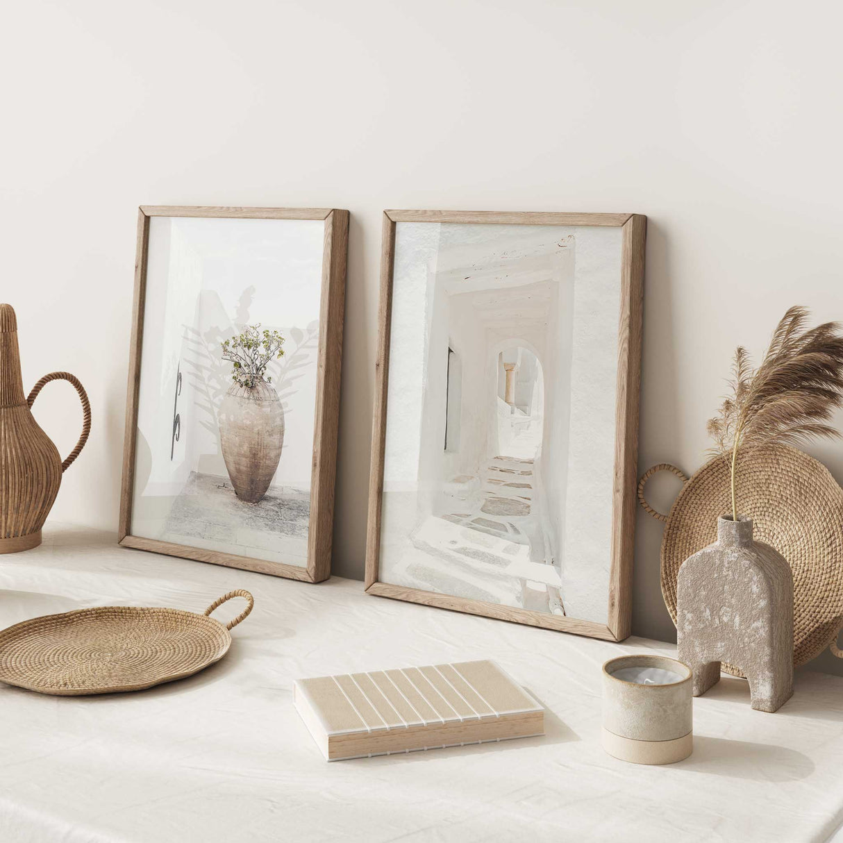 pair of mediterranean style prints with white passageway and large ceramic vase