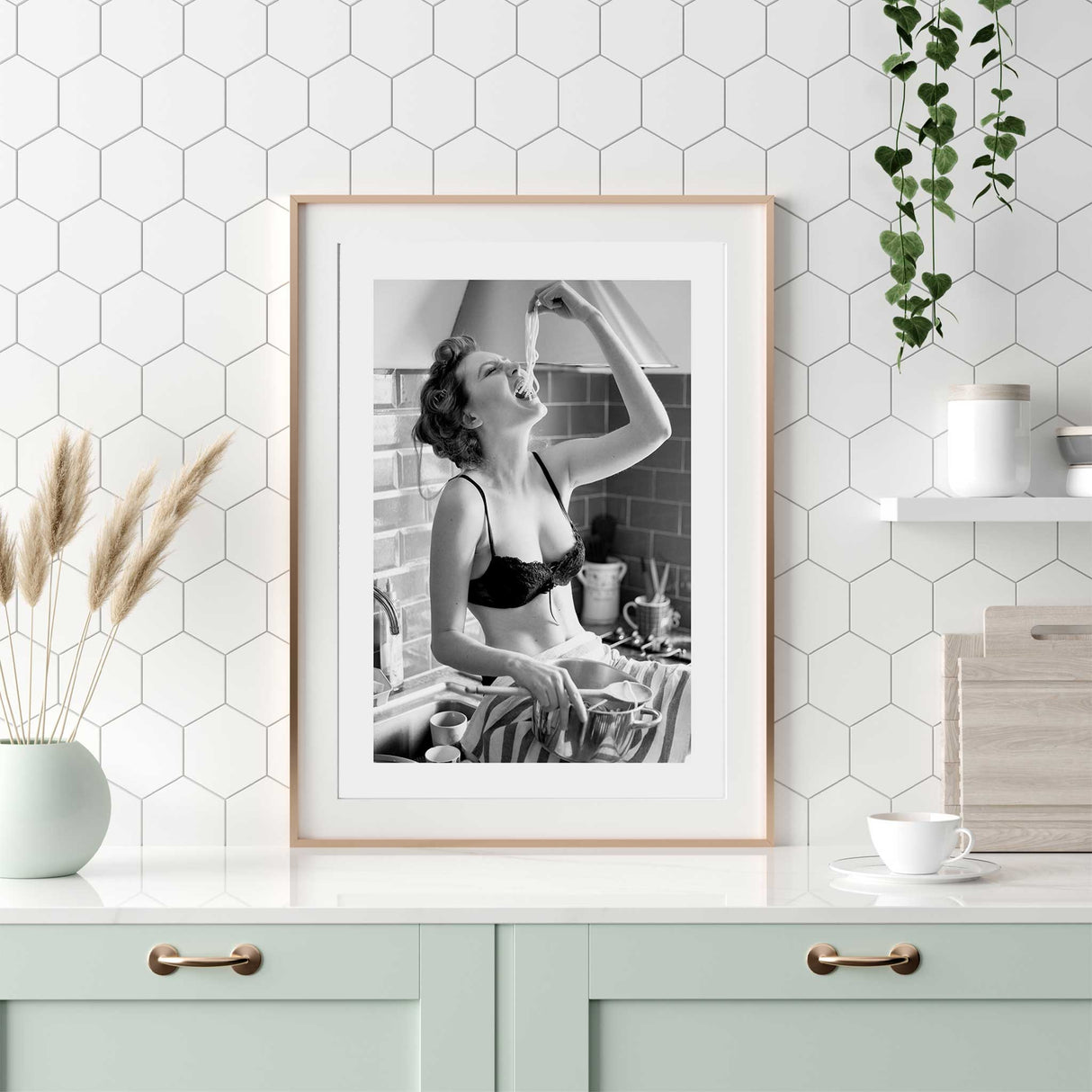 Monochrome kitchen wall print showing a woman enjoying pasta in vintage-inspired fashion.