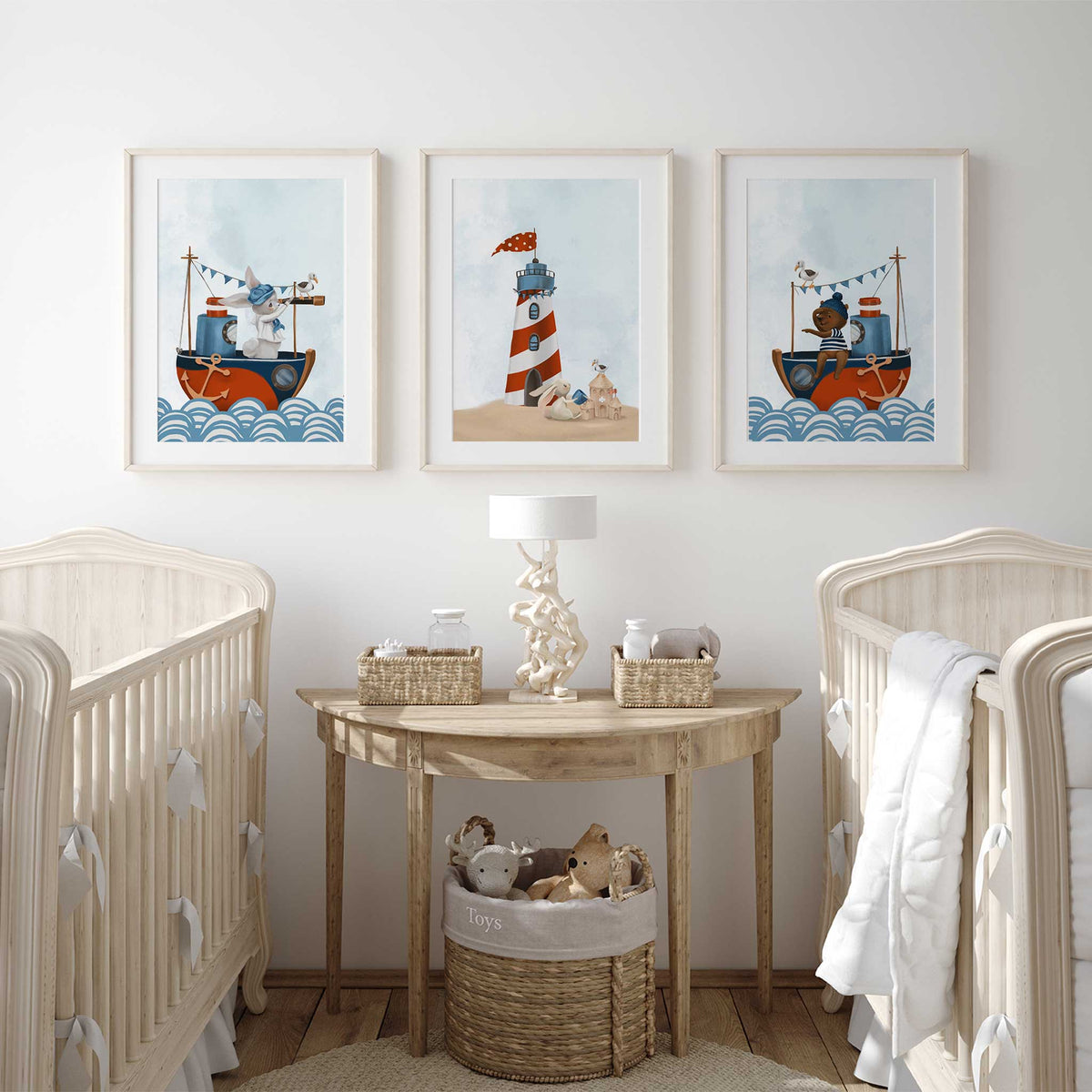 Three nautical nursery prints showing a bunny and teddy bear sailing boats beside a red and white striped lighthouse.