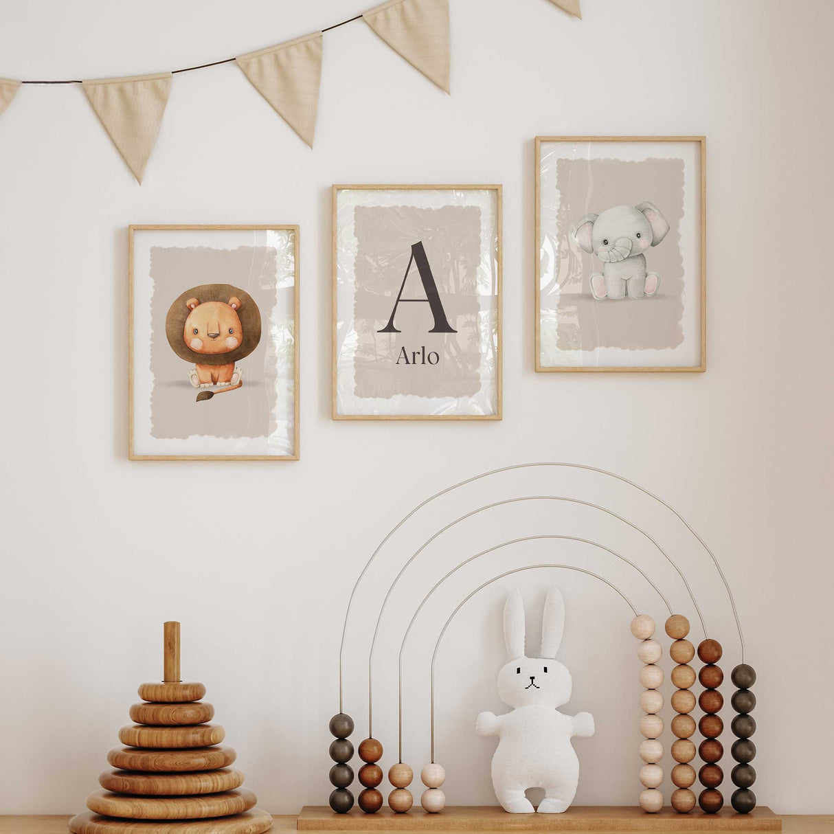 Customised baby name print set featuring lion, elephant, and soft beige tones for nursery wall decor.