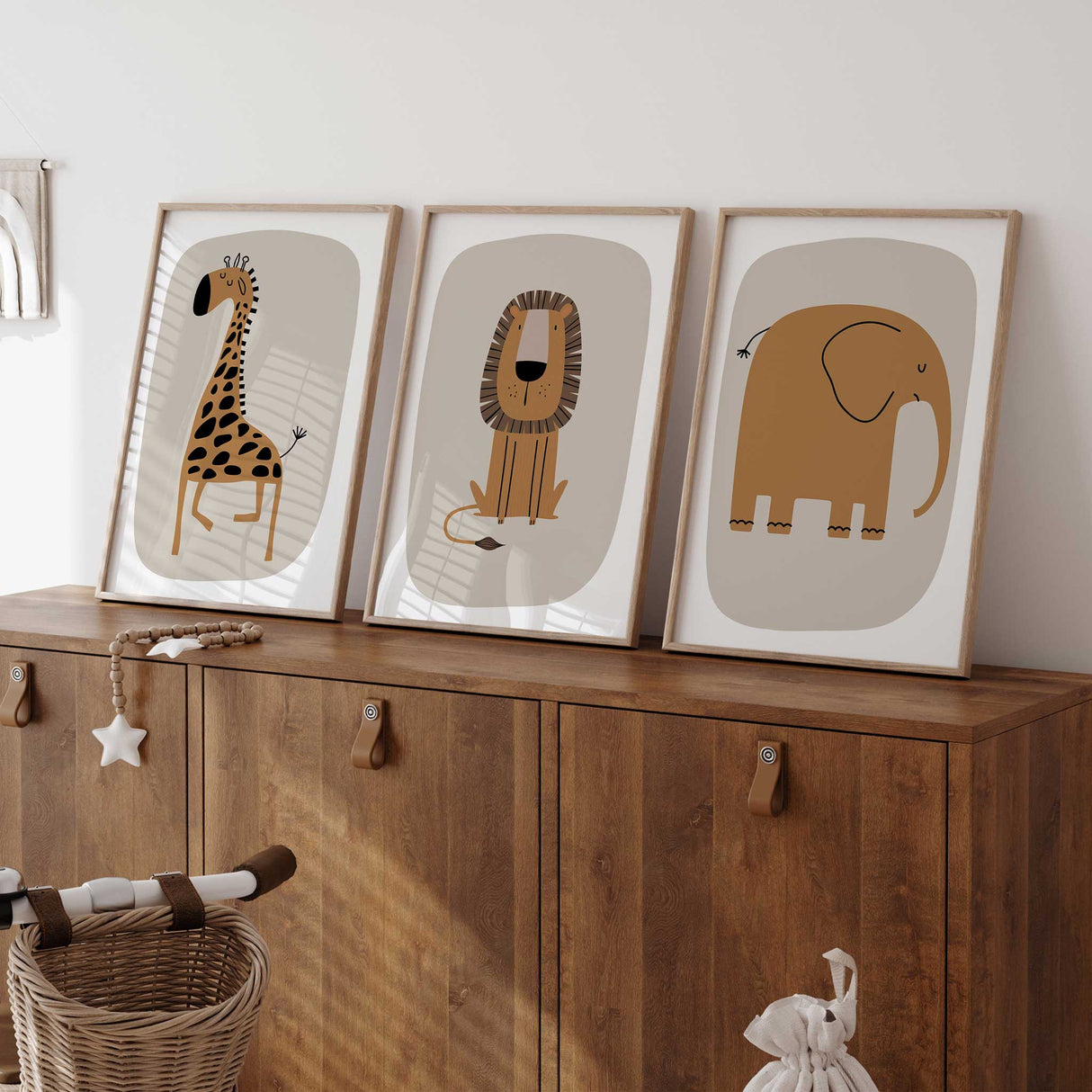 Safari-themed nursery wall art set featuring cute elephant, giraffe, and lion designs.