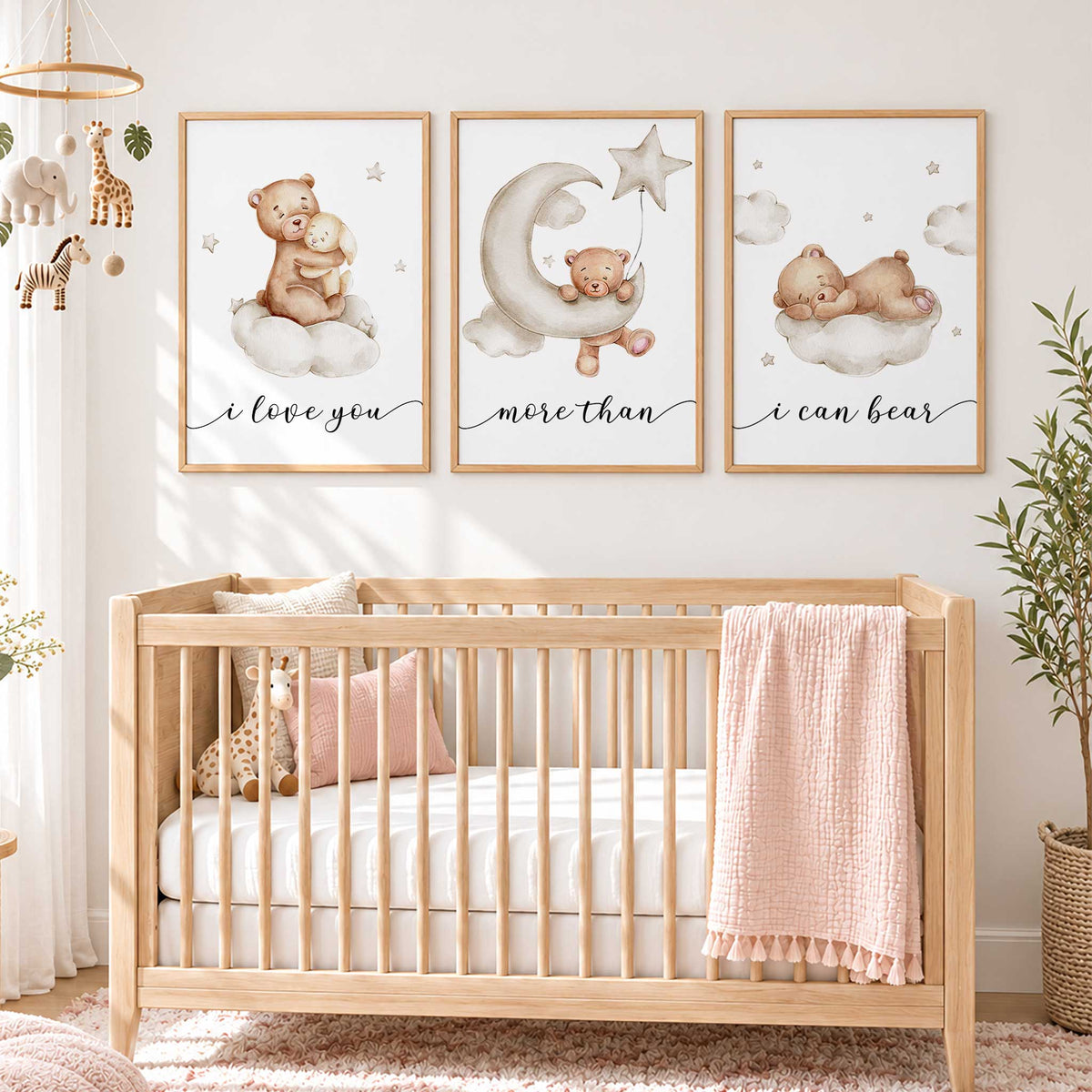 Three neutral teddy bear prints showing a bunny hug, a bear on a crescent moon and a sleeping bear on a cloud.