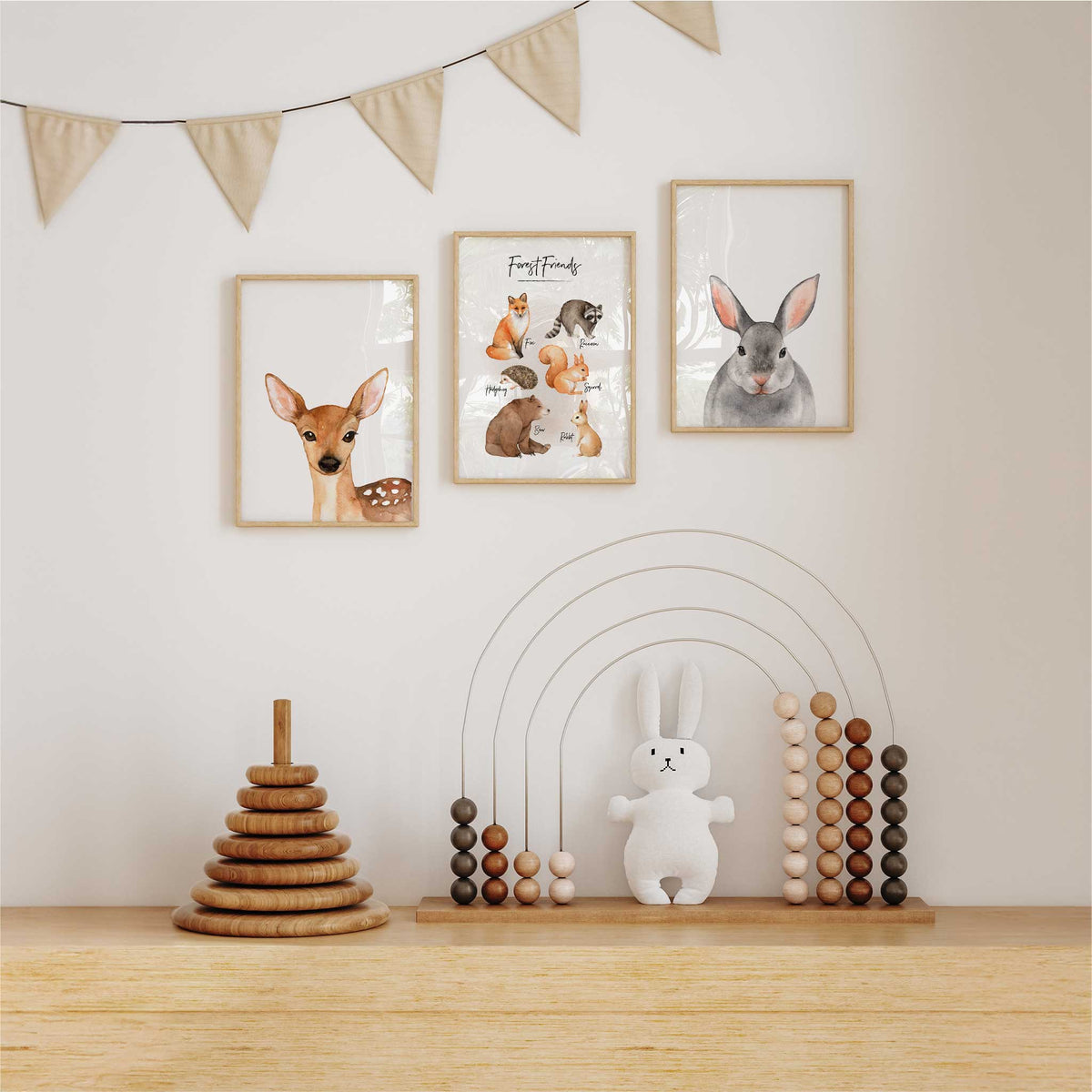 Three coordinated woodland animal artworks featuring a bunny, forest animal group and deer in soft natural tones