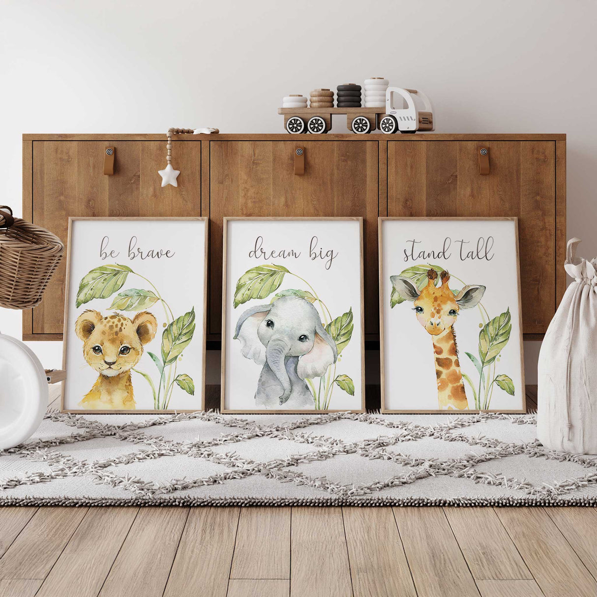 Nursery decor idea showcasing a set of inspirational safari animal prints with lion, elephant, and giraffe illustrations.