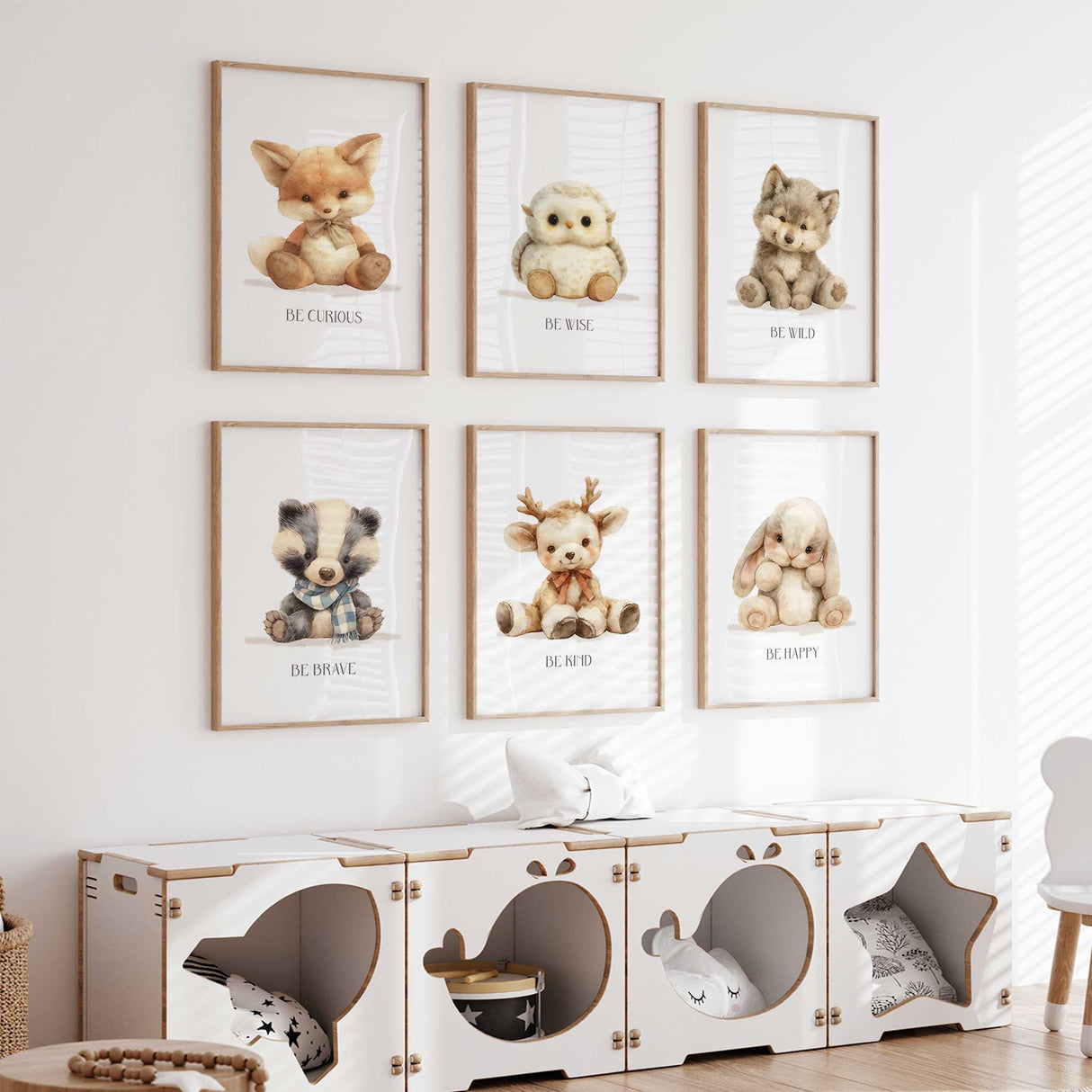 Owl and wolf forest-themed nursery wall art with phrases 'Be Wise' and 'Be Wild' in a gender-neutral playroom